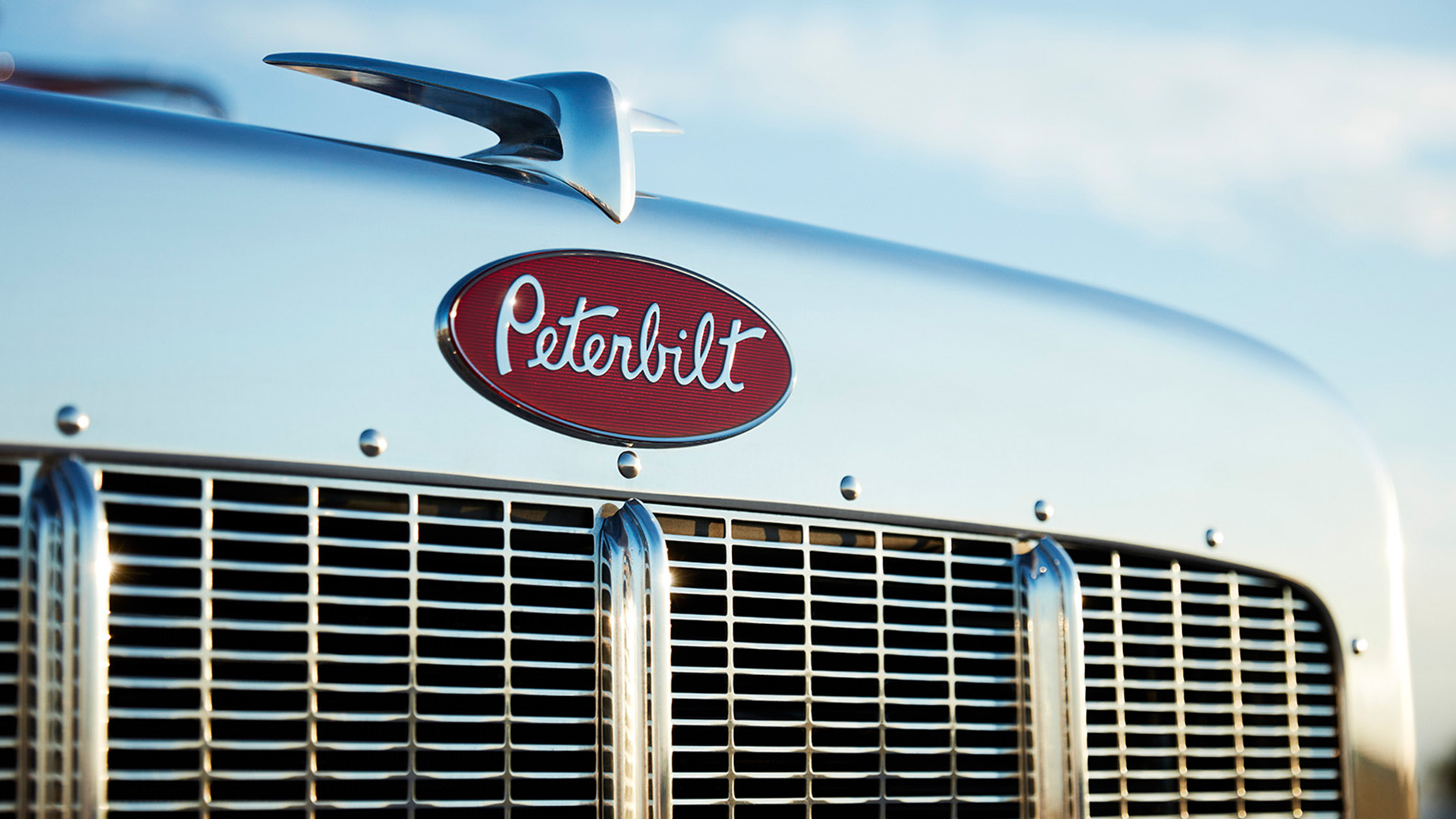 Banner Background - Every Peterbilt truck that rolls off the assembly line embodies the heritage of our brand that started with our first truck, the 1939 Model 334, which evolved to iconic status with the Model 359. Our evolution continues with inspired styling, high-quality materials and meticulous attention to detail. The results are pure legendary Peterbilt vehicles that possess distinctive styling that evolves the brand DNA, as well as a premium driver environment that is ergonomic and highly comfortable.