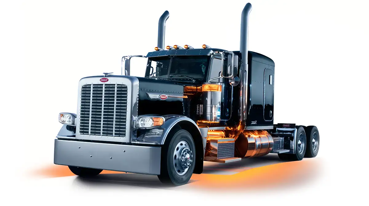 Black Peterbilt Model 389X truck with glowing lights - Feature Image