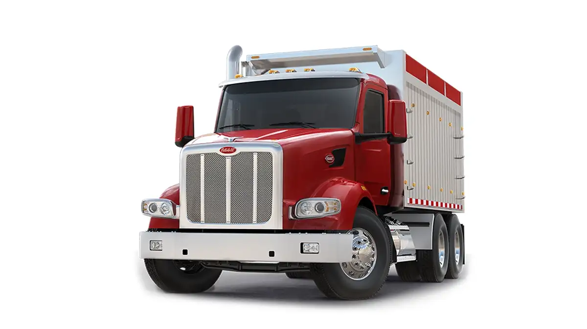 Peterbilt Model 567 Vocational Red Truck with Dump Body Isolated - Feature Image