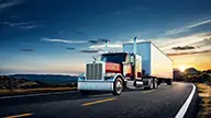 Peterbilt Model 589 On-Highway Drives on Road at Sunset - Thumbnail