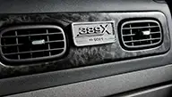 Peterbilt Model 389X serialized badge showcased on the Black Pearl Burl Woodgrain dash panel - Thumbnail